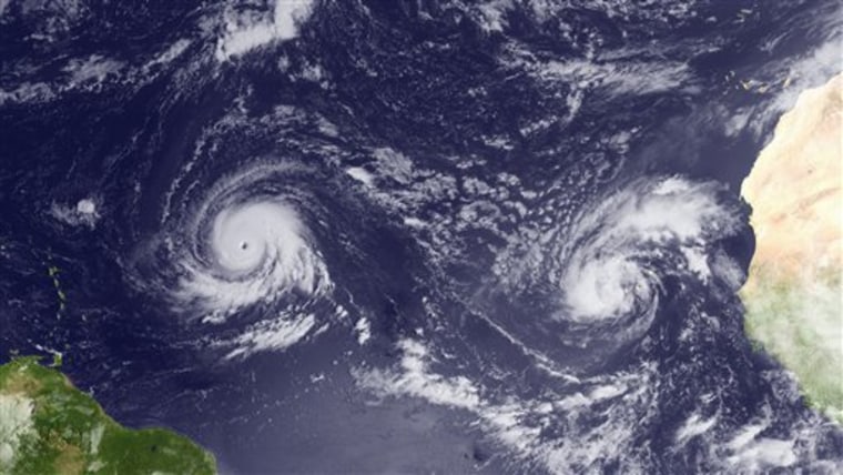 This satellite-based image taken Monday shows Hurricane Igor, left, and Tropical Storm Julia, right.